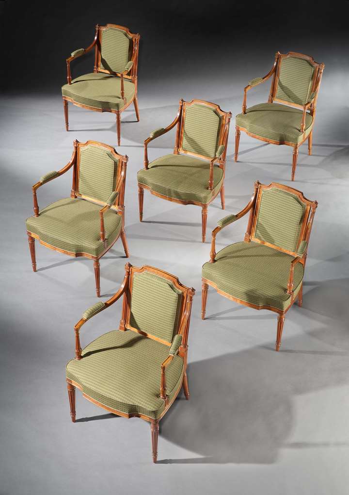A SET OF SIX GEORGE III SATINWOOD ARMCHAIRS